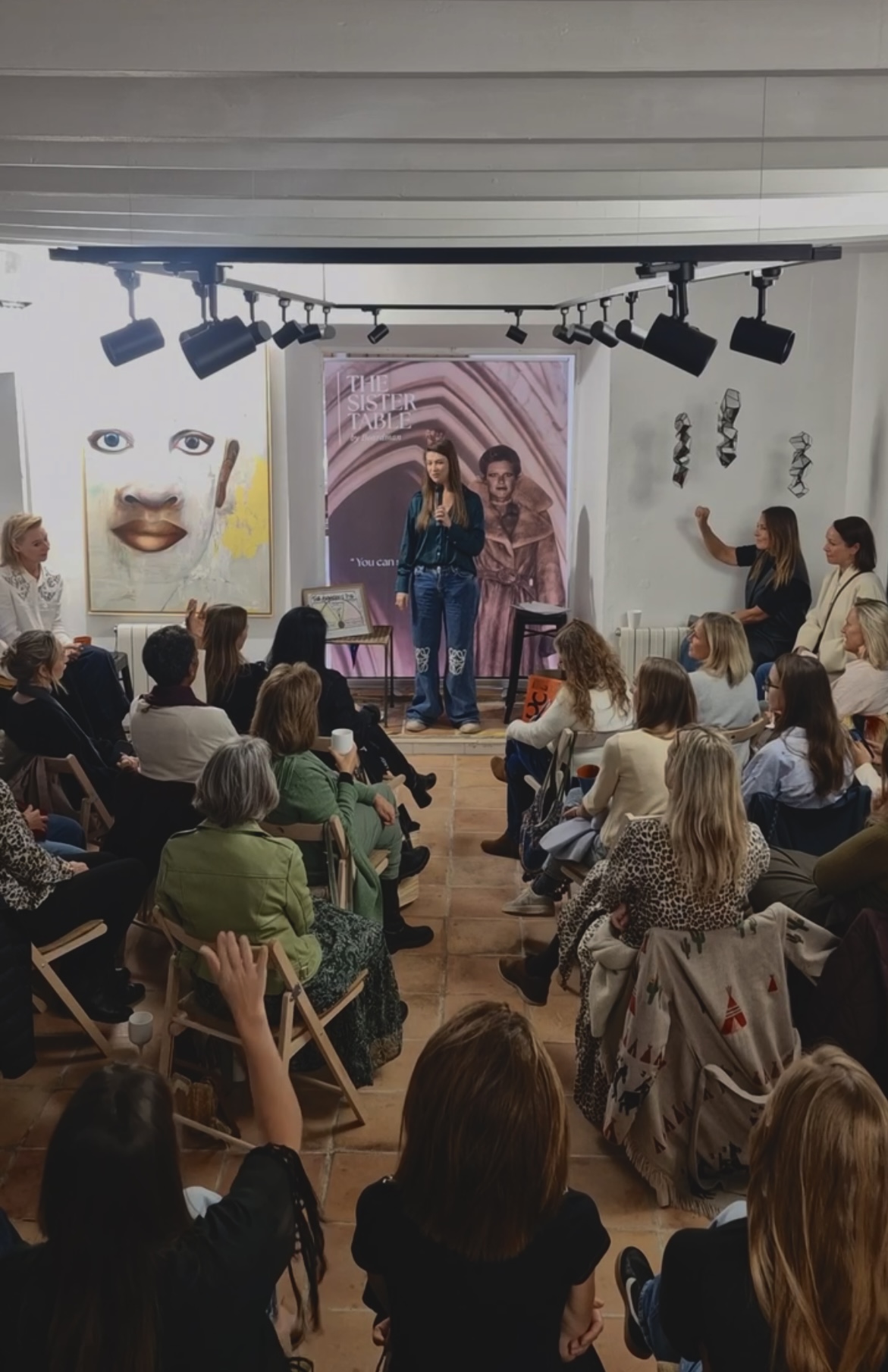 Valeriiya speaking at The Sister Table Intelligence Salon, Mallorca, room of women